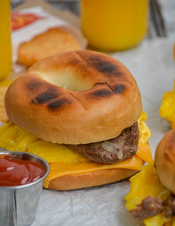a copycat mcdonald's steak egg and cheese bagel on parchment paper