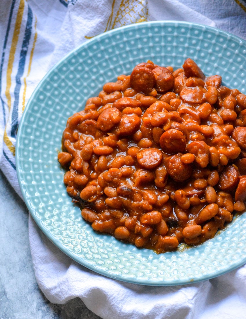 copycat beanie weenies recipe served on a small blue dinner plate