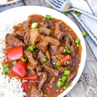 instant pot beijing beef on a white bowl over steamed white rice