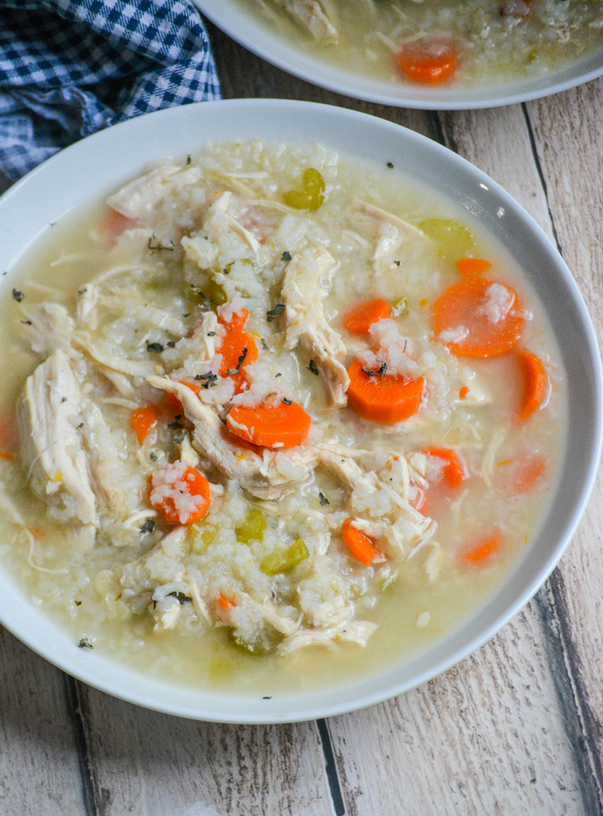 two white bowls filled with instant pot chicken and rice soup