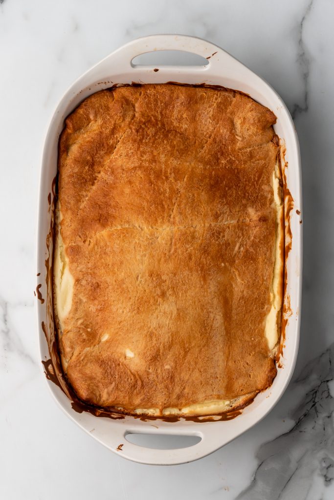 baked crescent roll cheesecake in a casserole dish