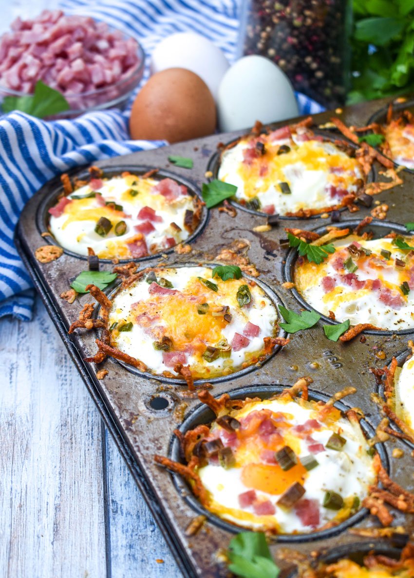 baked hash brown nests in a metal muffin tin