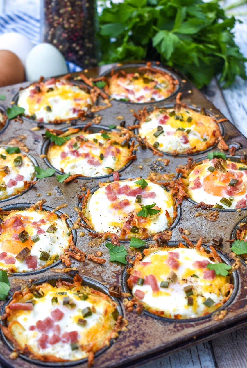 baked hash brown nests in a metal muffin tin