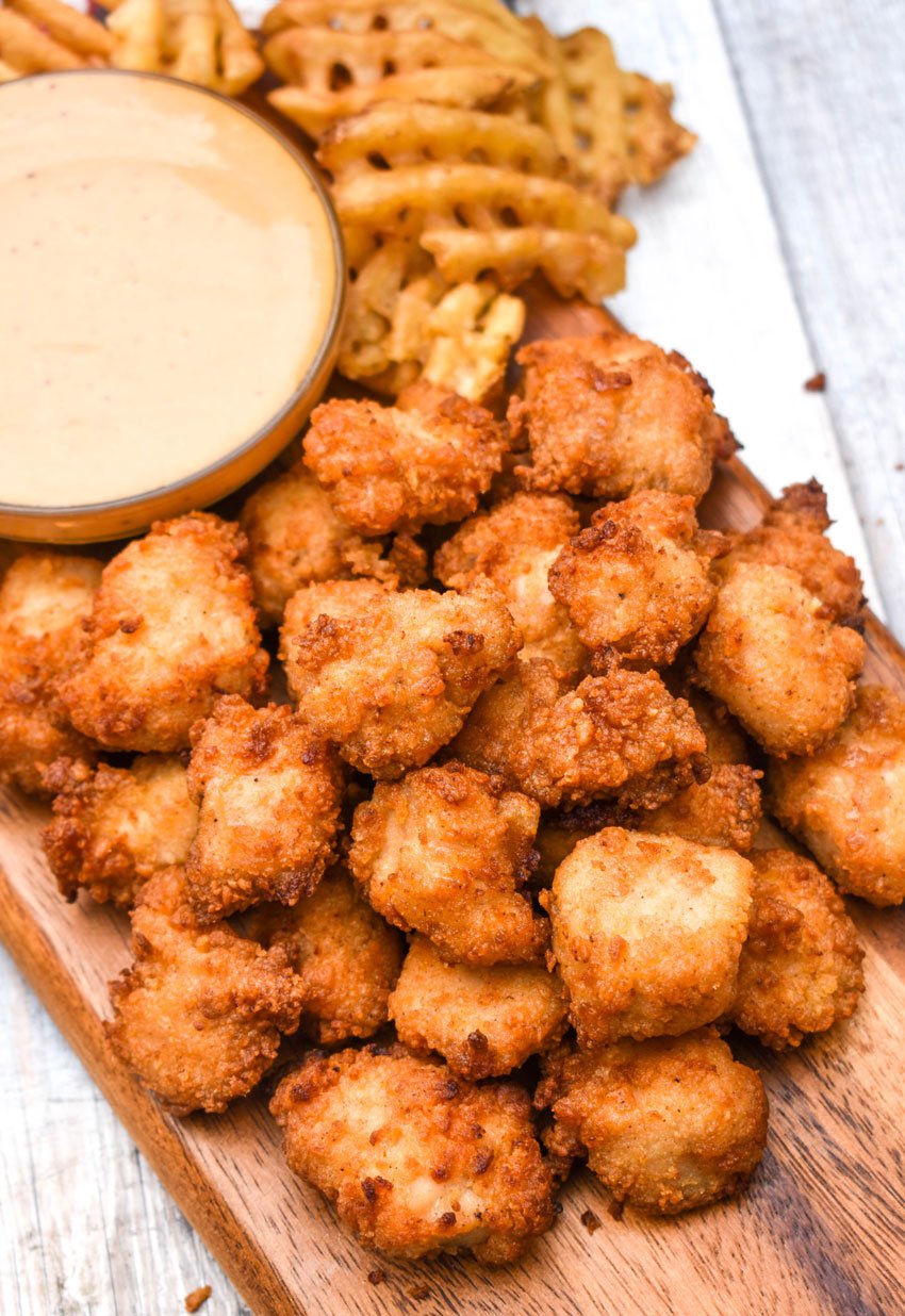 copycat chick fil a nuggets on a wooden cutting board