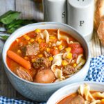 Instant pot beef noodle soup in small gray bowls