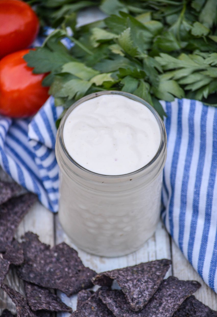 Mexican white sauce in a small glass jar