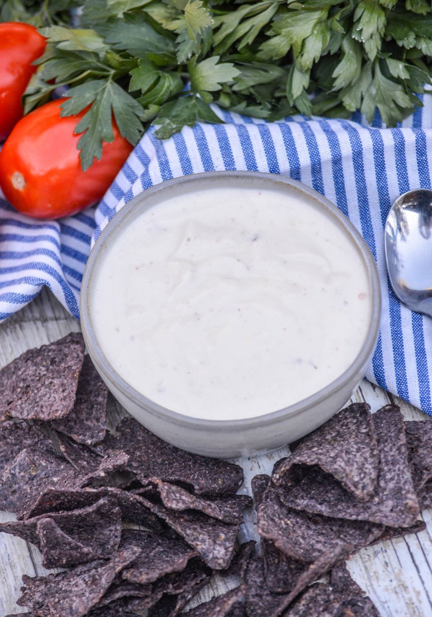 a small gray bowl filled with Mexican white ranch sauce