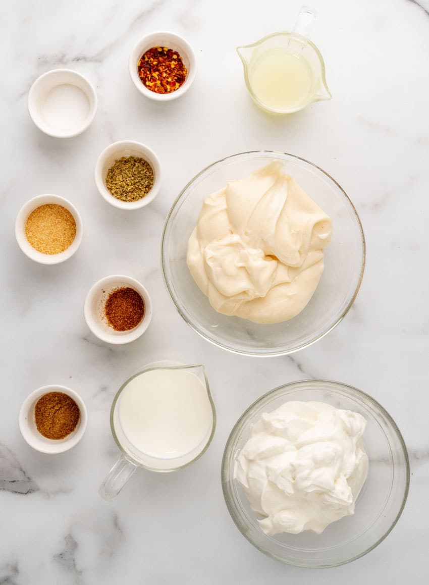 an overhead image showing the measured ingredients needed to make a mexican white sauce for chips
