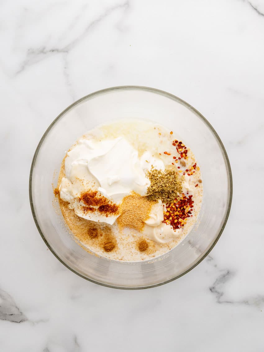 mexican white sauce ingredients in a glass mixing bowl