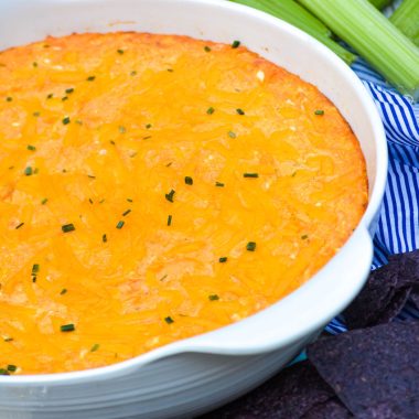 the best buffalo chicken dip in a white serving bowl