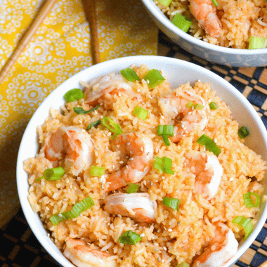 two white bowls filled with instant pot sweet and sour shrimp with rice
