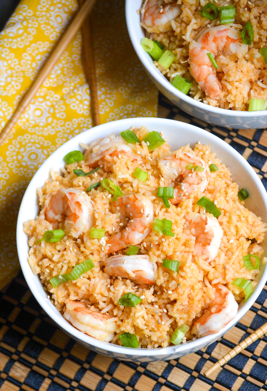 two white bowls filled with instant pot sweet and sour shrimp with rice
