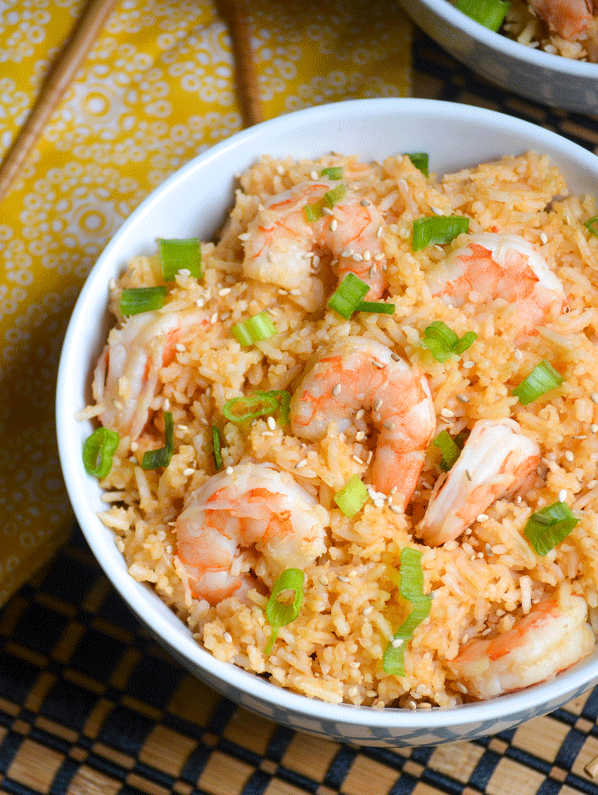 instant pot sweet and sour shrimp in a white bowl topped with sliced green onions