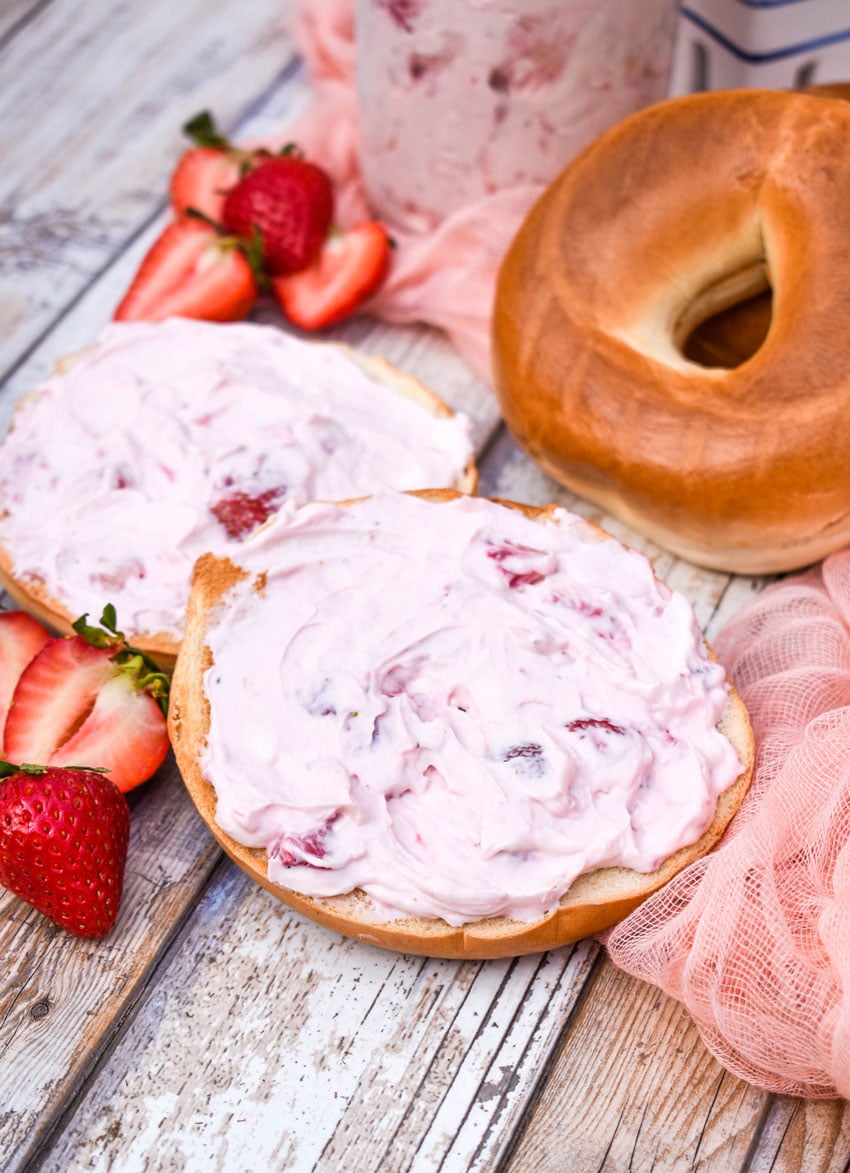 two bagels spread with easy strawberry cream cheese spread