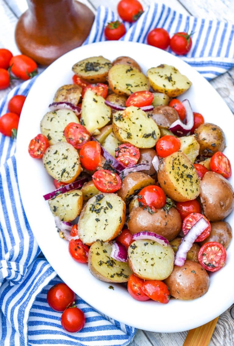 nonna's italian potato salad in a white serving dish