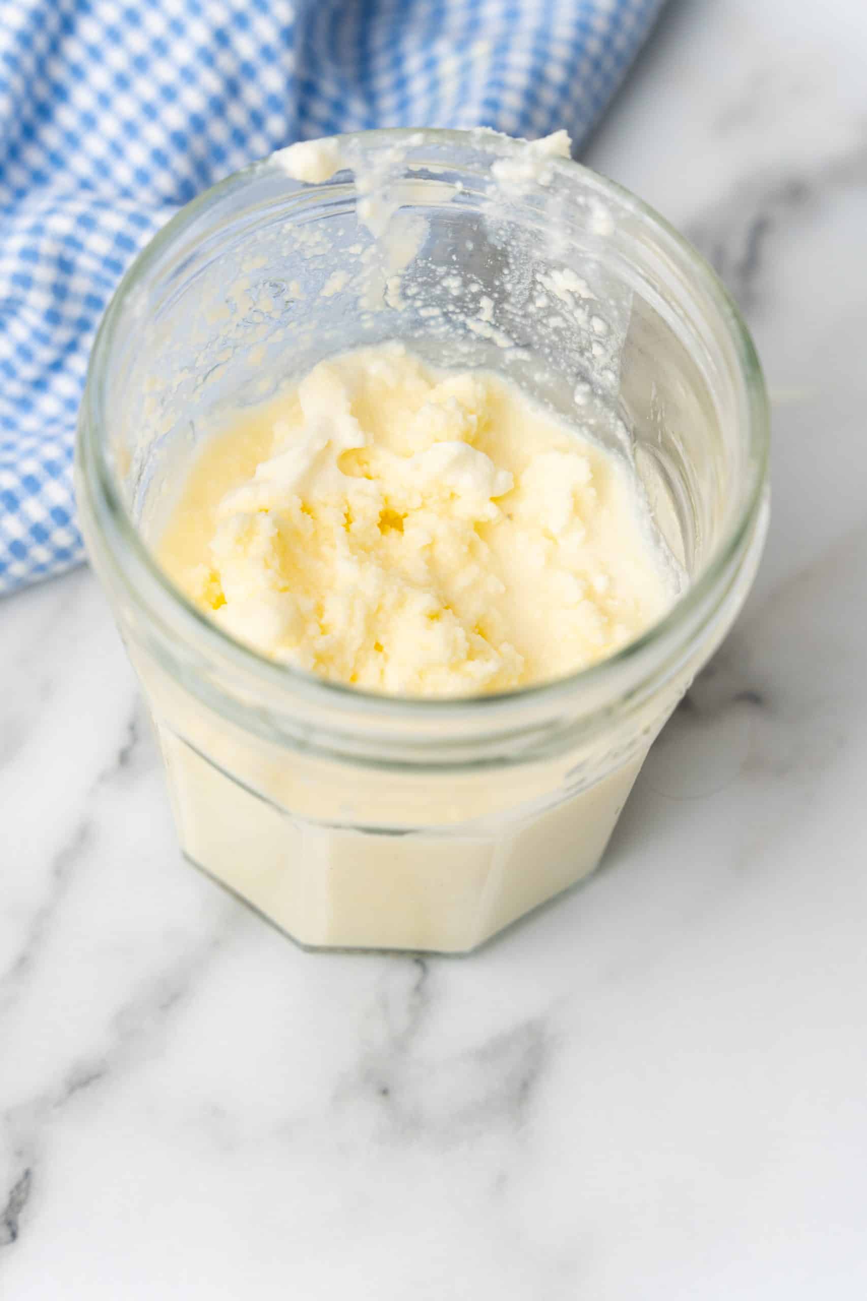 homemade butter and buttermilk in a small glass jar