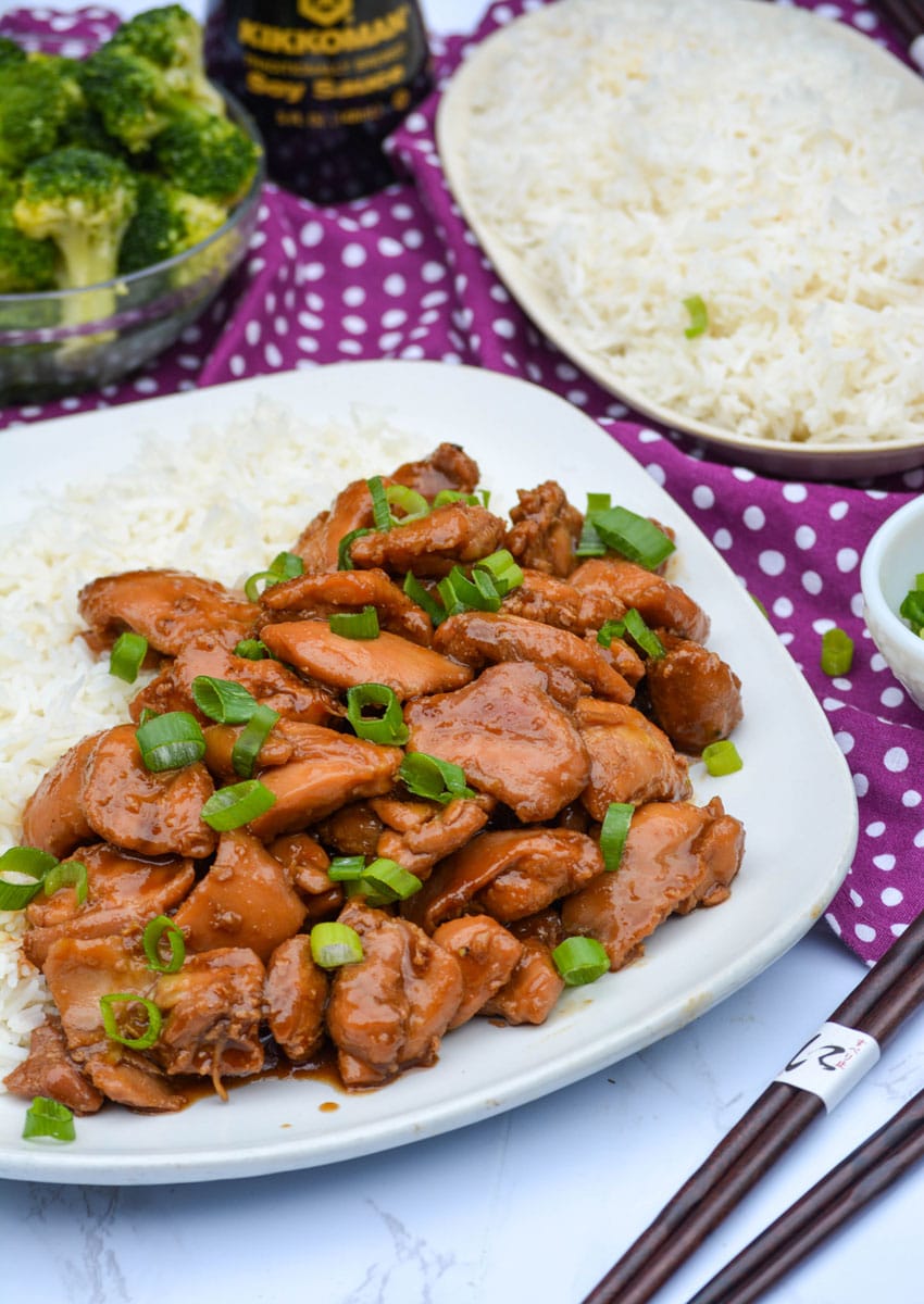 food court bourbon chicken served on a white plate with steamed white rice