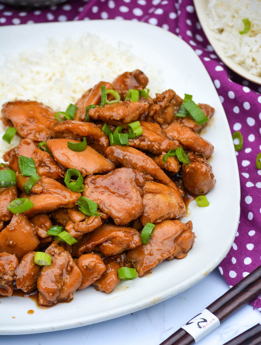 food court bourbon chicken served on a white plate with steamed white rice