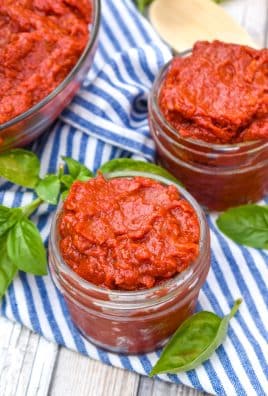 homemade tomato paste in small glass jars