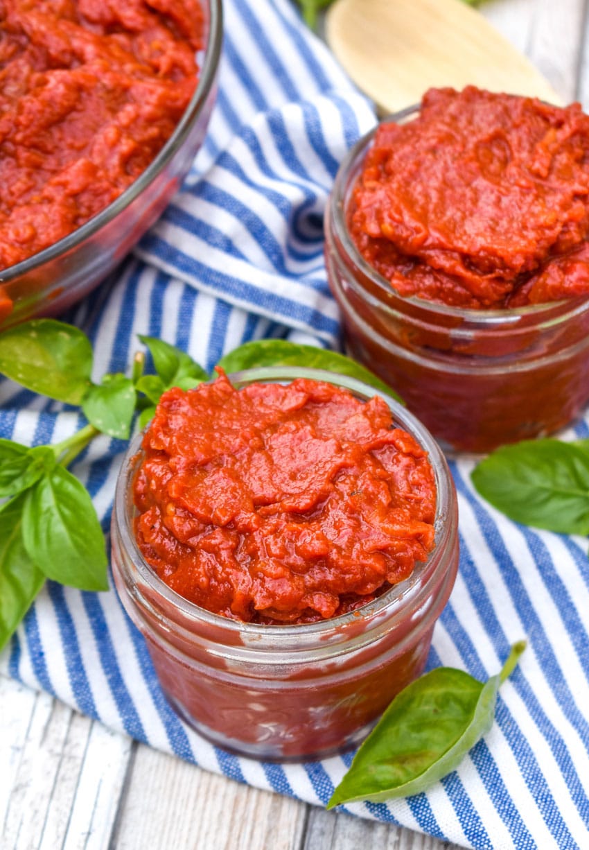 homemade tomato paste in small glass jars