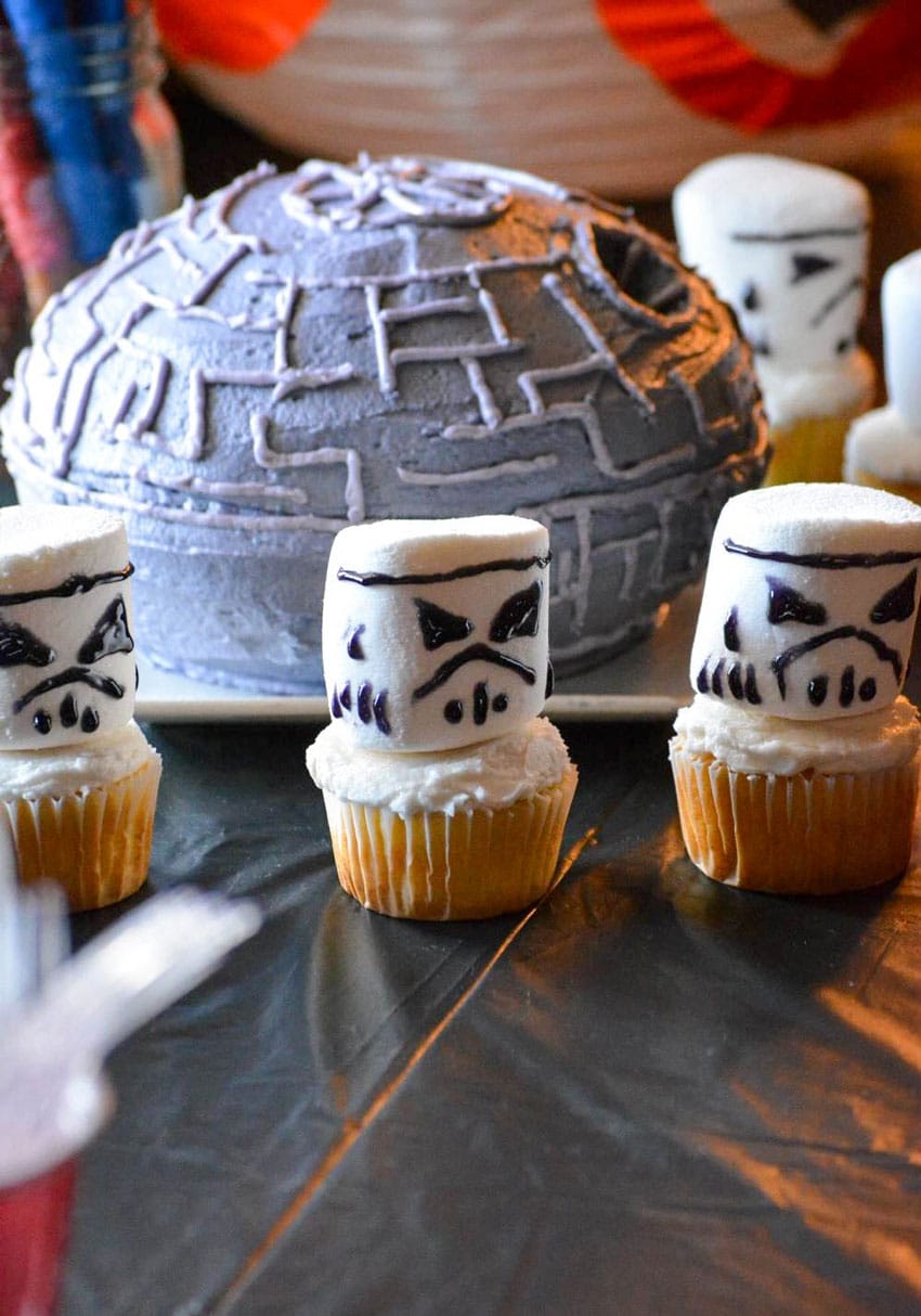 storm trooper cupcakes on a black party table
