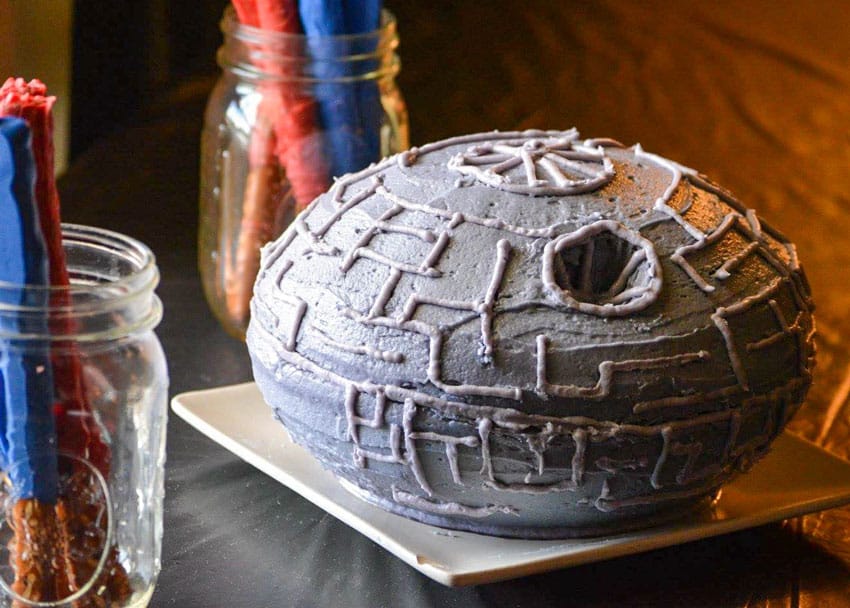 homemade death star cake on a black party table