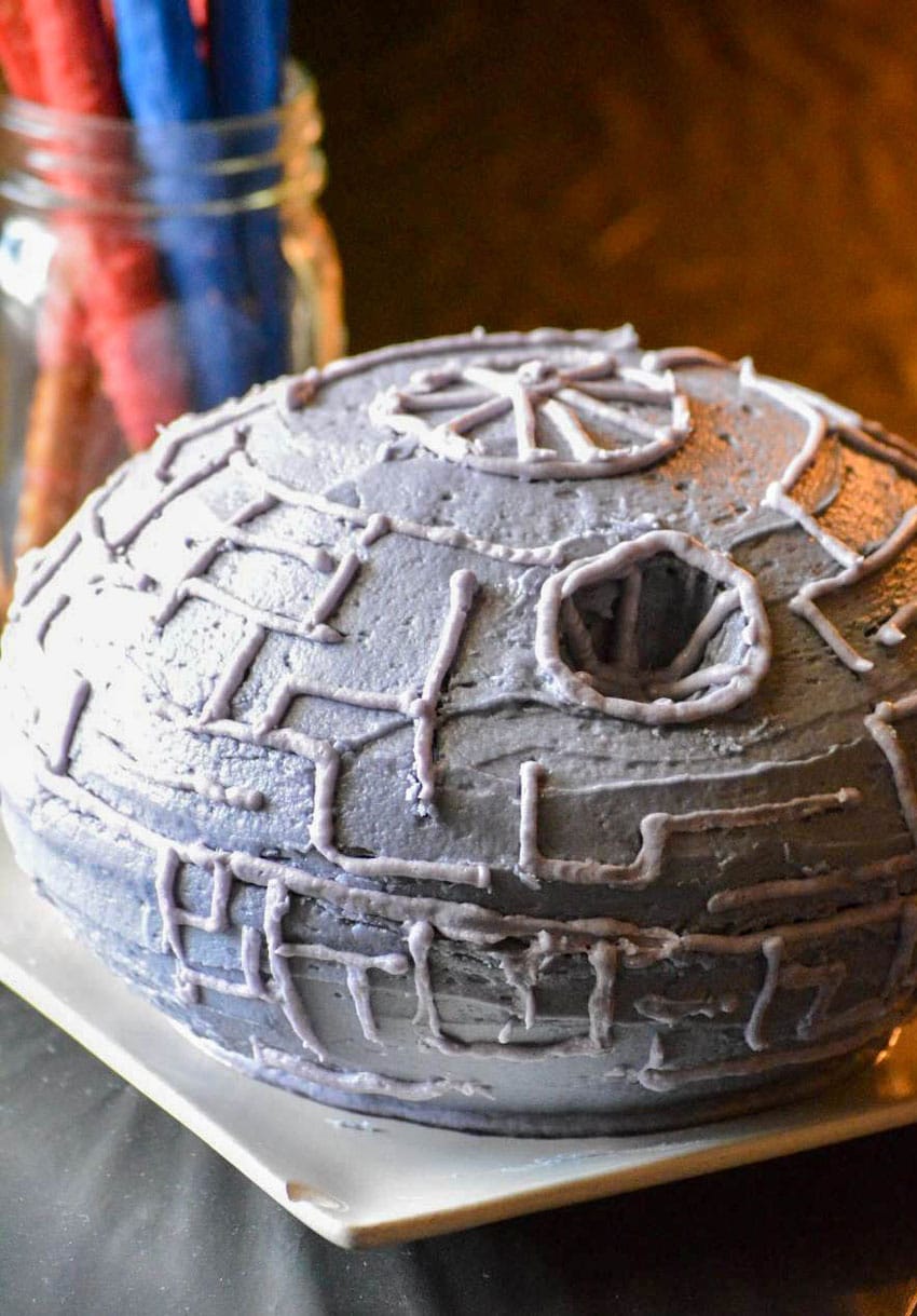 homemade death star cake on a black party table