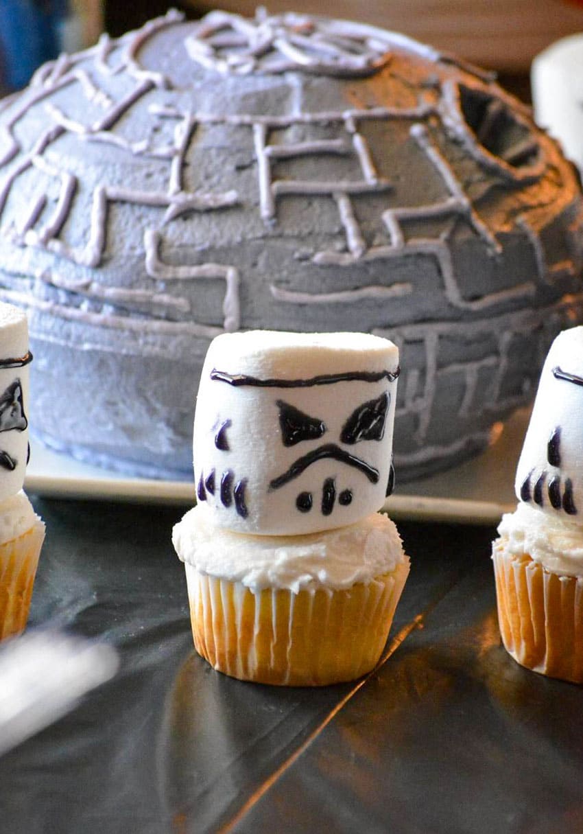storm trooper cupcakes on a black party table