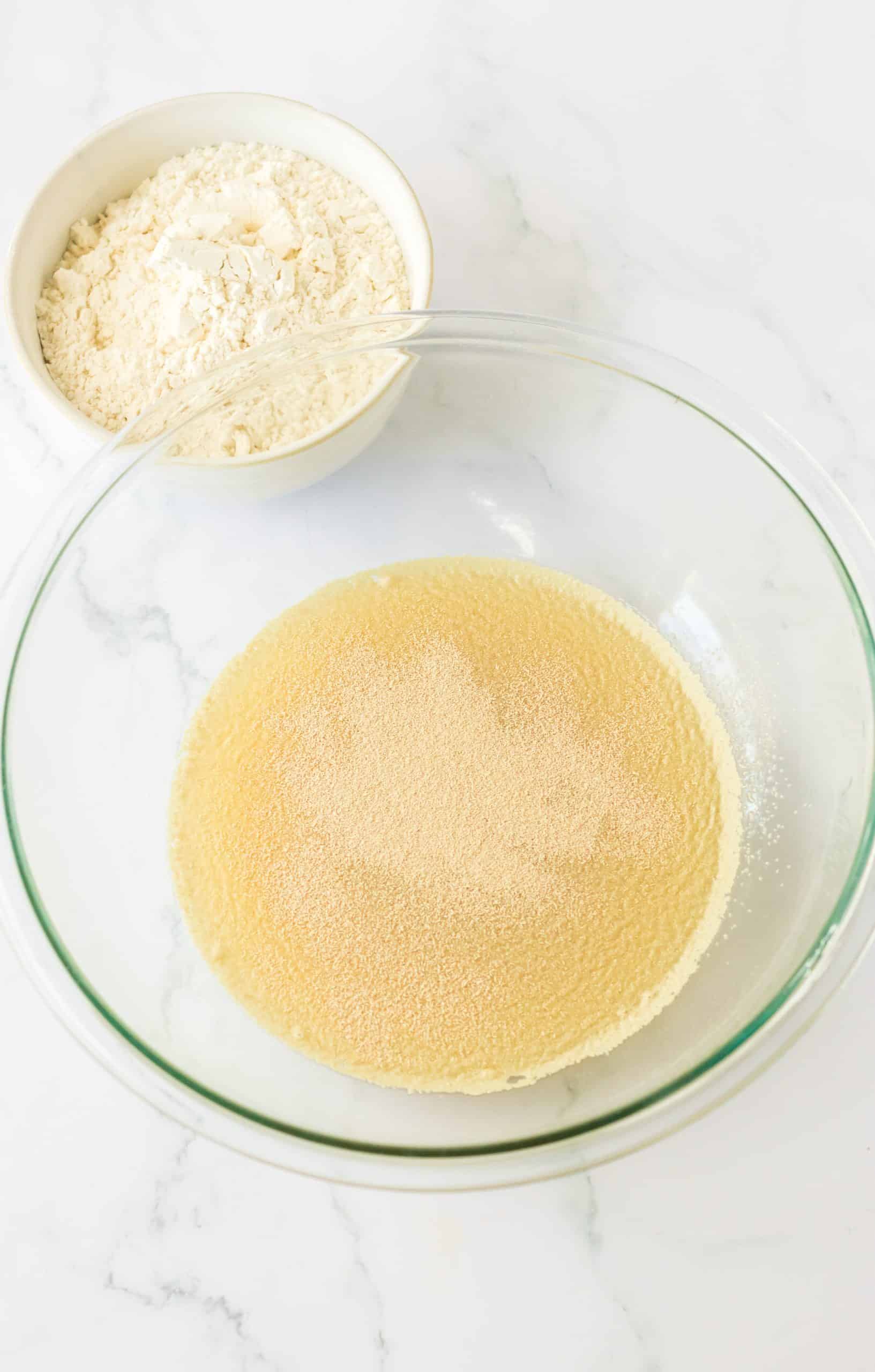 pineapple juice and yeast in a large glass mixing bowl