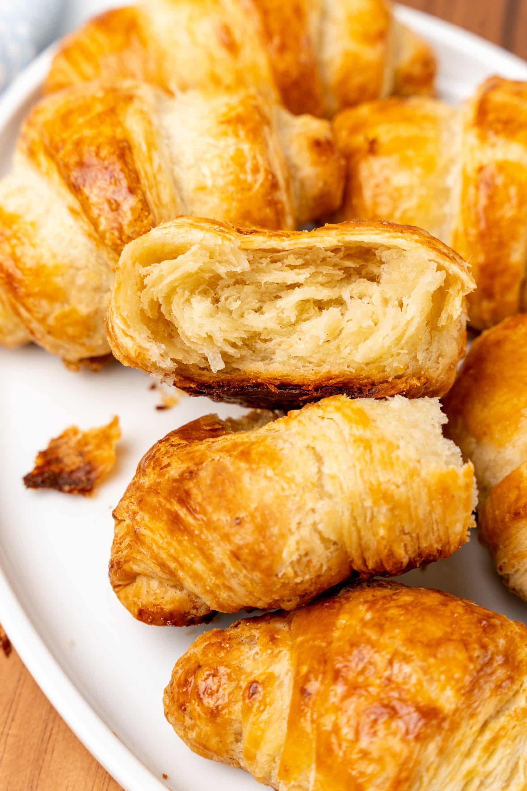 easy butter croissant rolls piled on a white plate