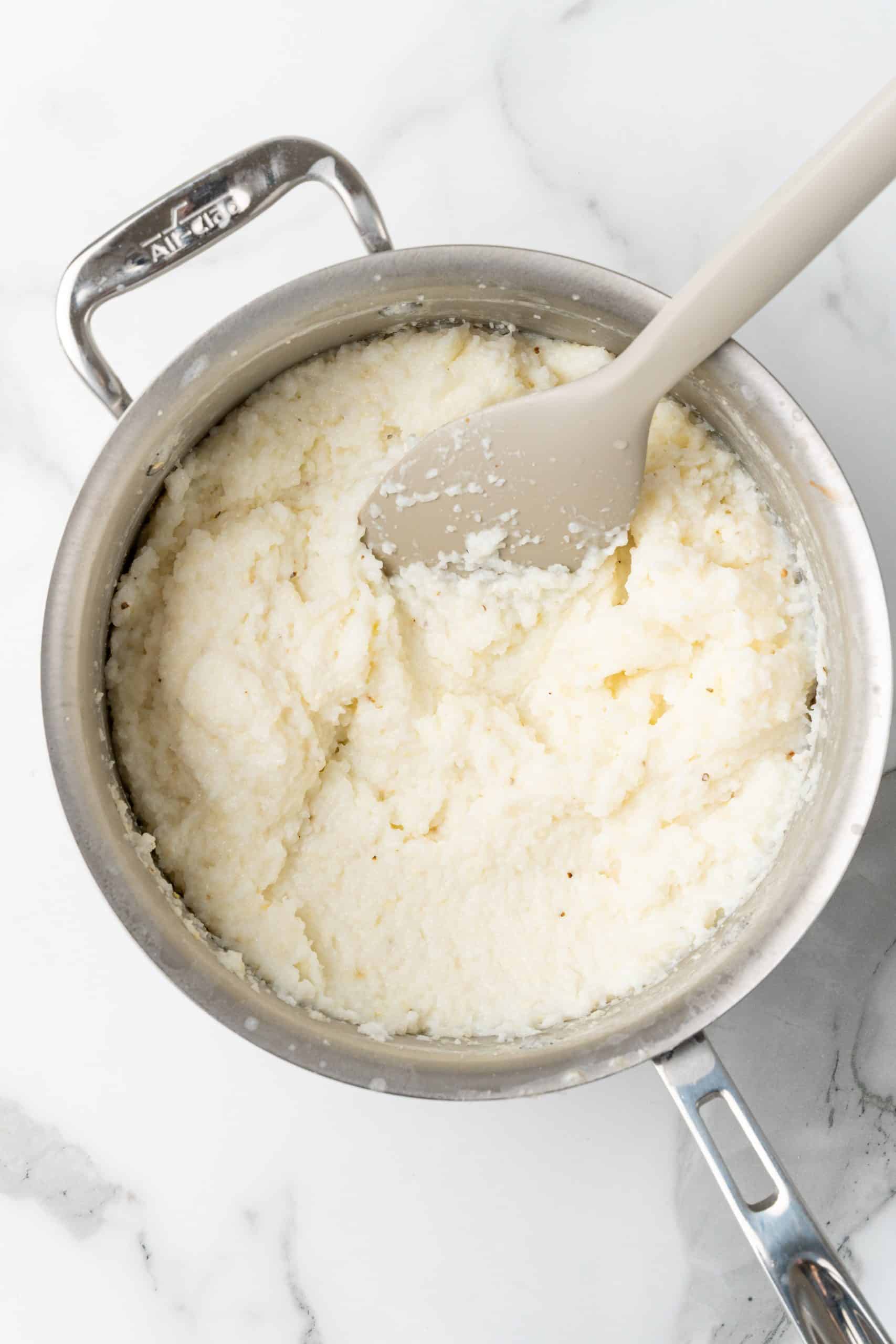 leftover grits in a silver pot