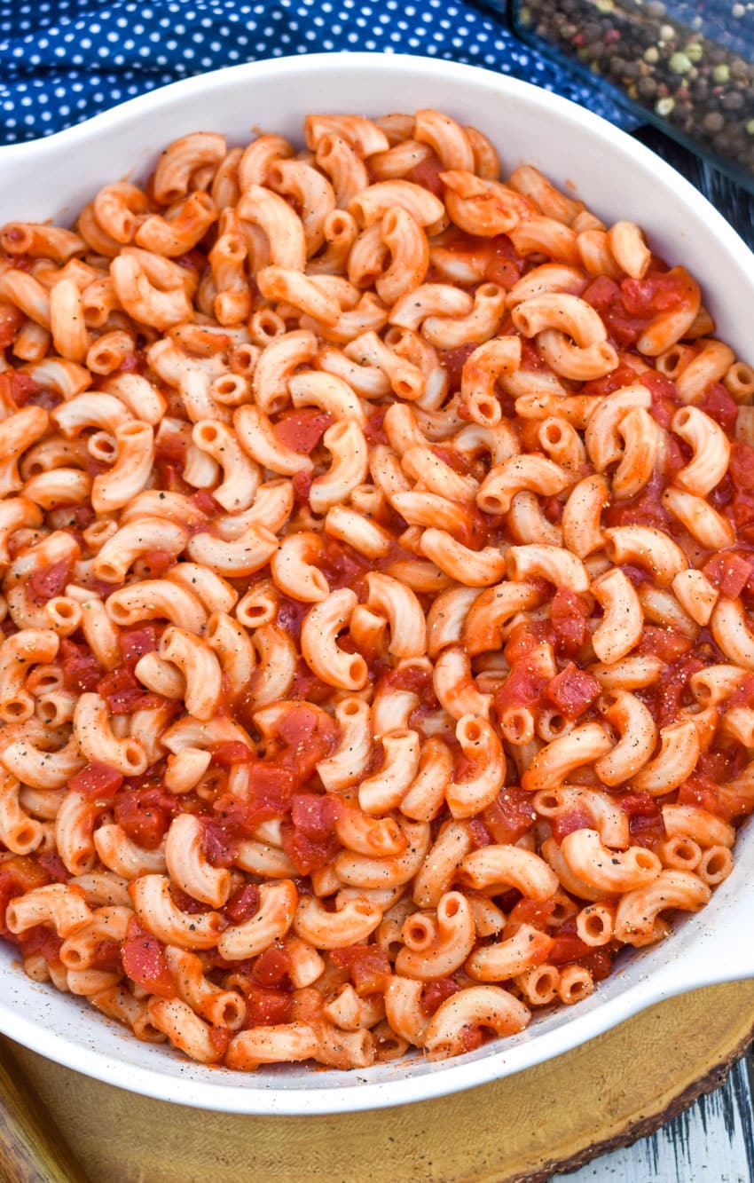 southern tomatoes and macaroni in a large white serving bowl
