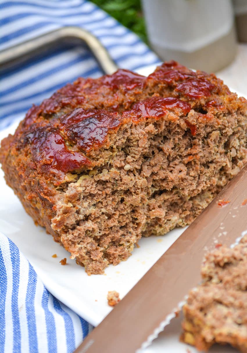 grandma's classic meatloaf recipe on a white serving platter