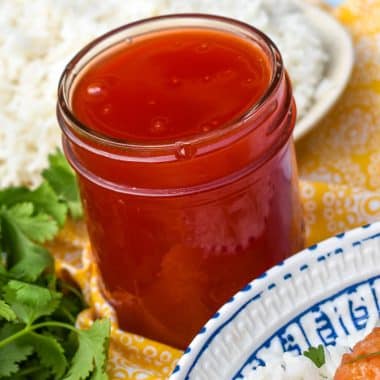 homemade sweet and sour sauce in a glass jar
