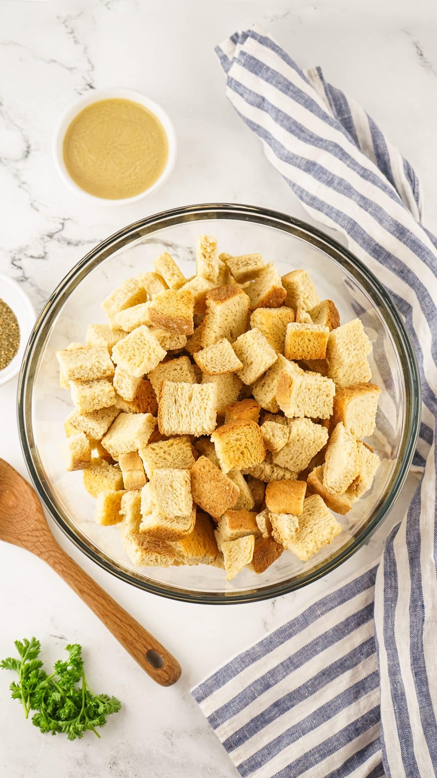 bread cubes in a glass mixing bowl