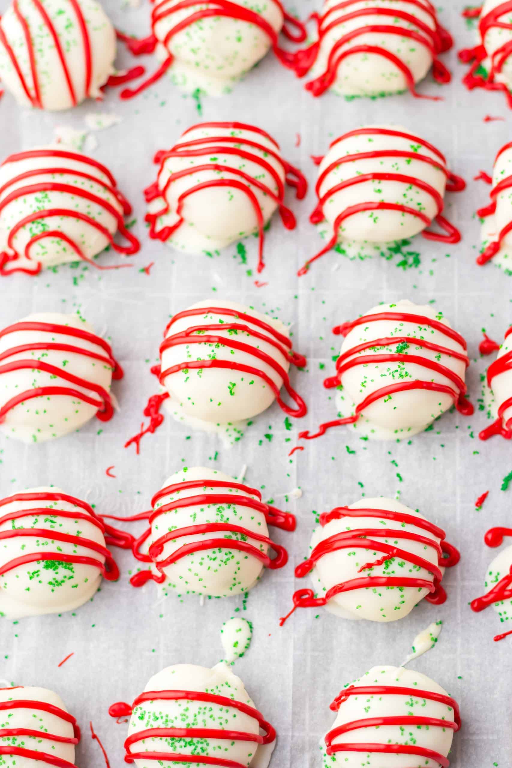 little debbie christmas tree cake truffles on a parchment paper lined baking sheet