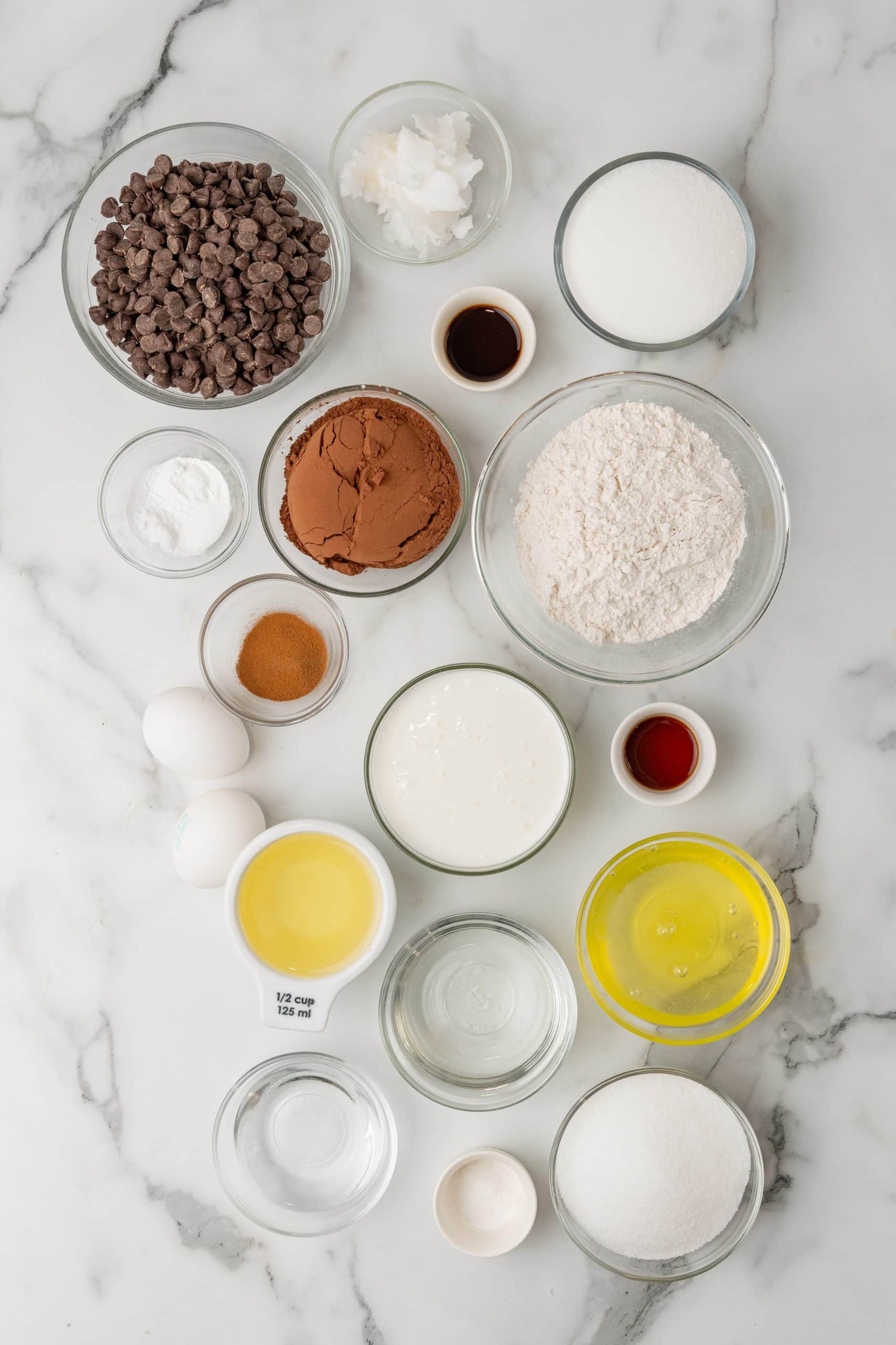 an overhead image showing the measured ingredients needed to make a batch of hi hat cupcakes