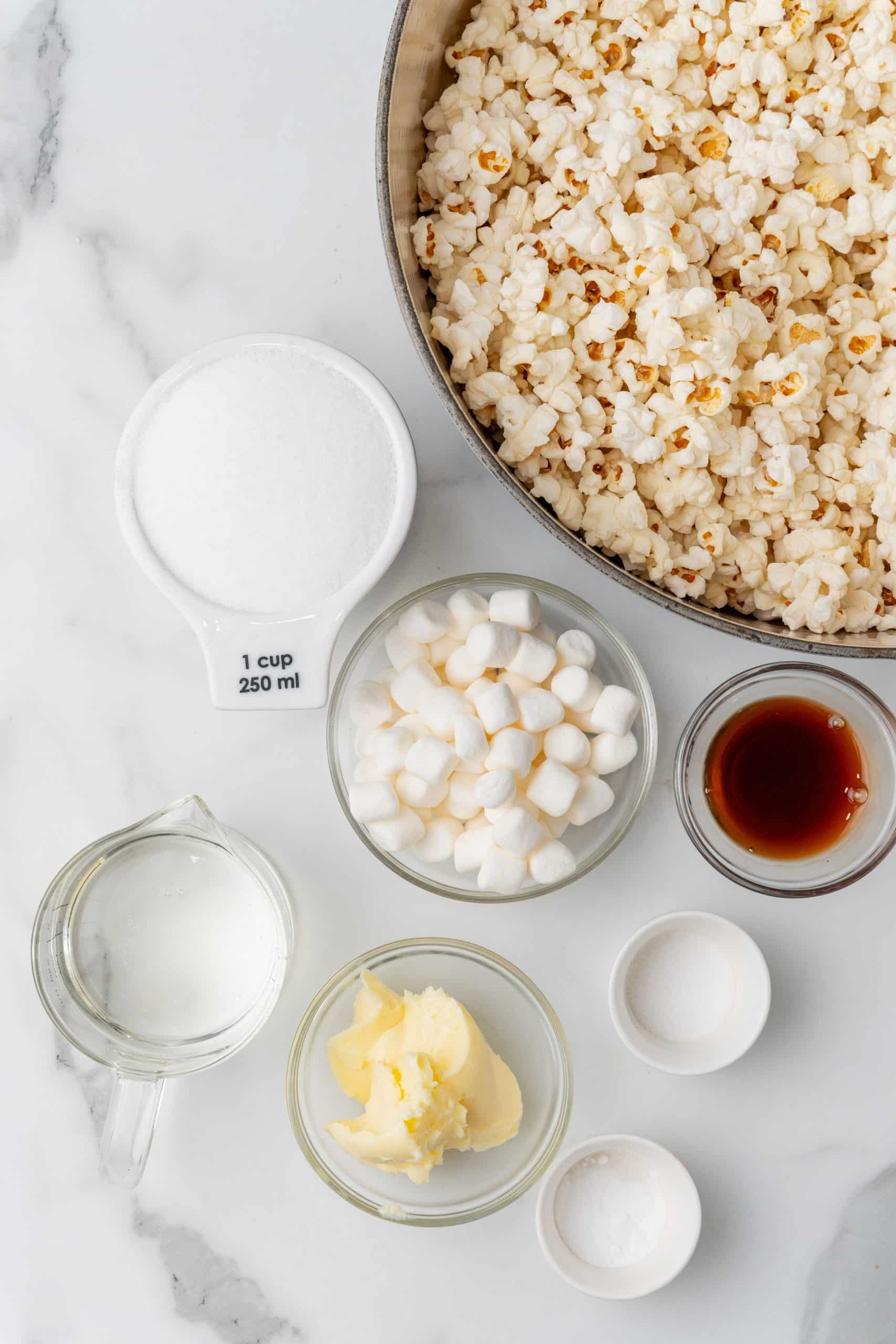 an overhead image showing the measured ingredients needed to make a batch of homemade popcorn balls