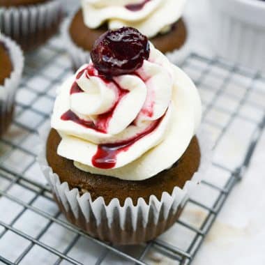 black forest cupcakes on a wire cooling rack