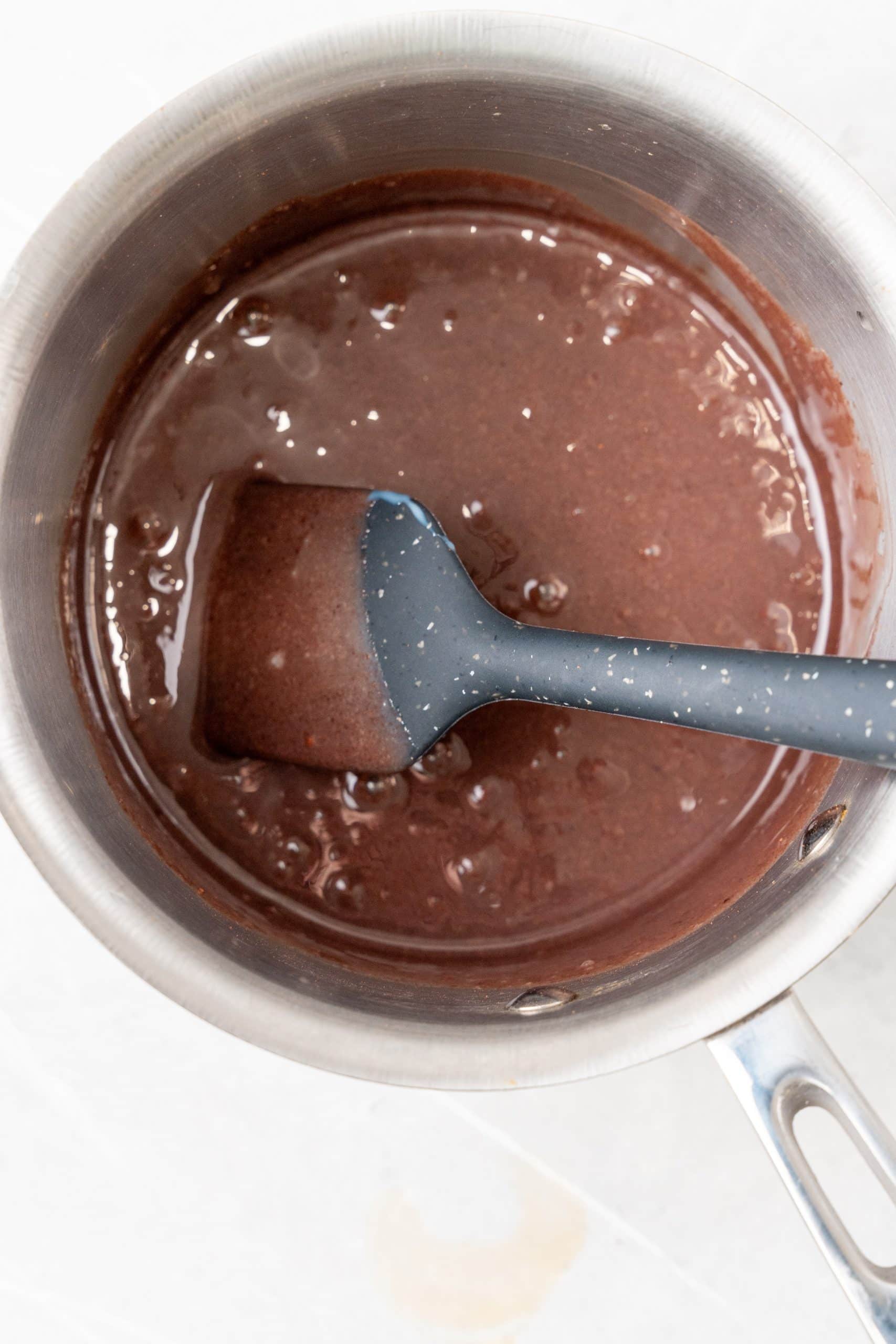 chocolate sauce in a small metal pot