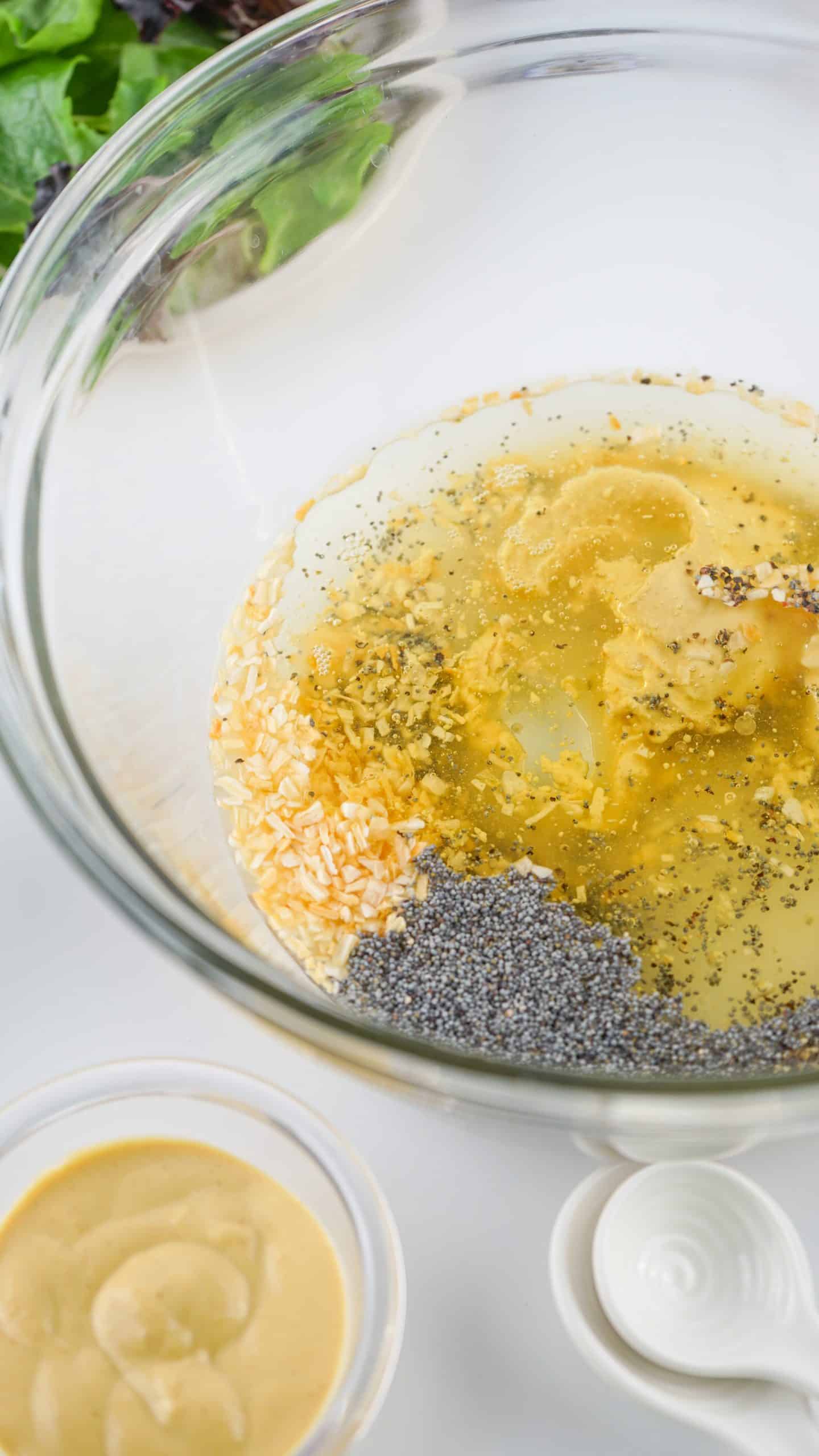 homemade poppy seed dressing ingredients in a glass mixing bowl