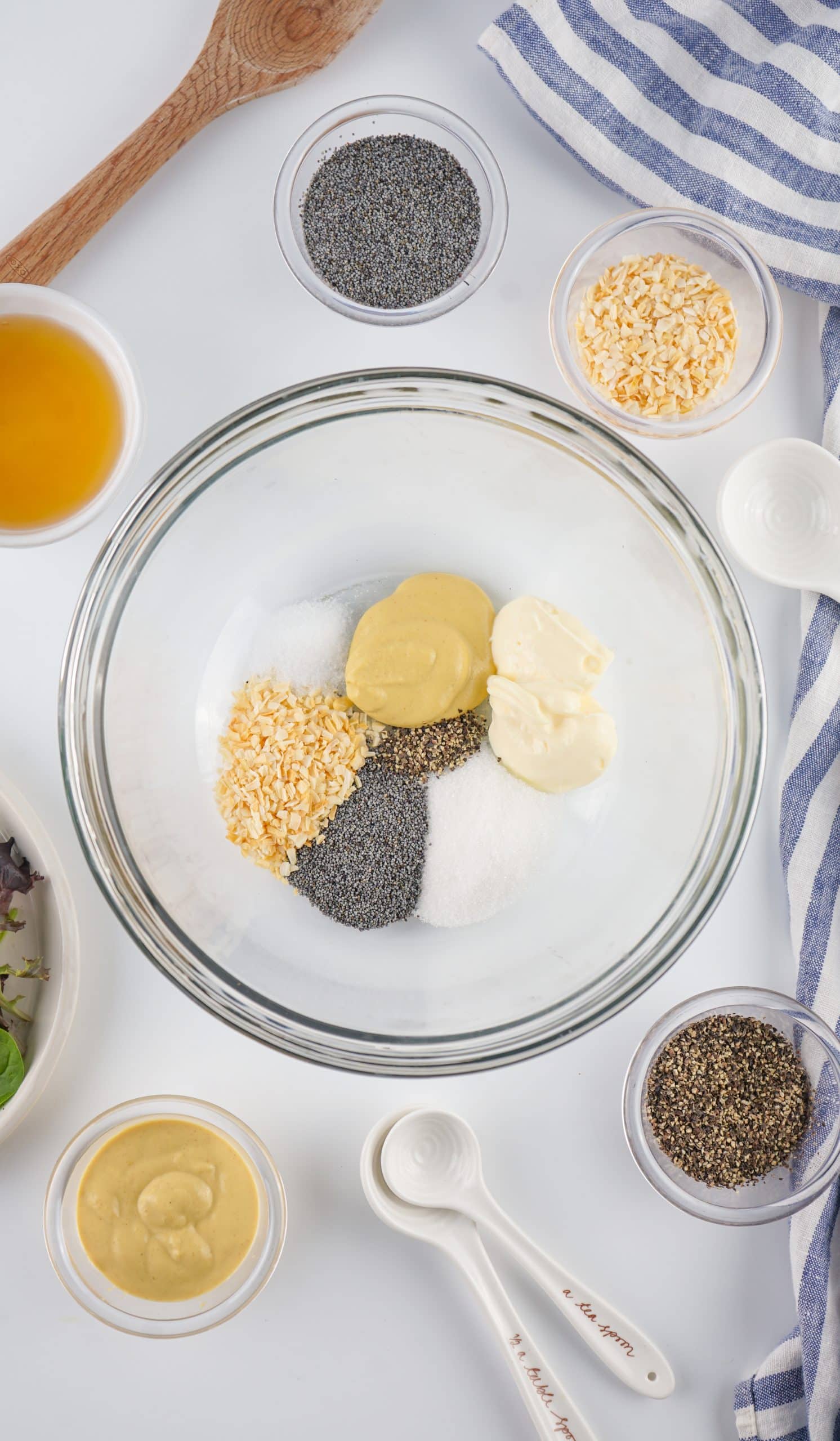 homemade poppy seed dressing ingredients in a glass bowl