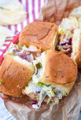 chopped italian sliders in a brown parchment paper lined lunch basket