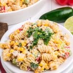 mexican street corn pasta salad on a small white plate