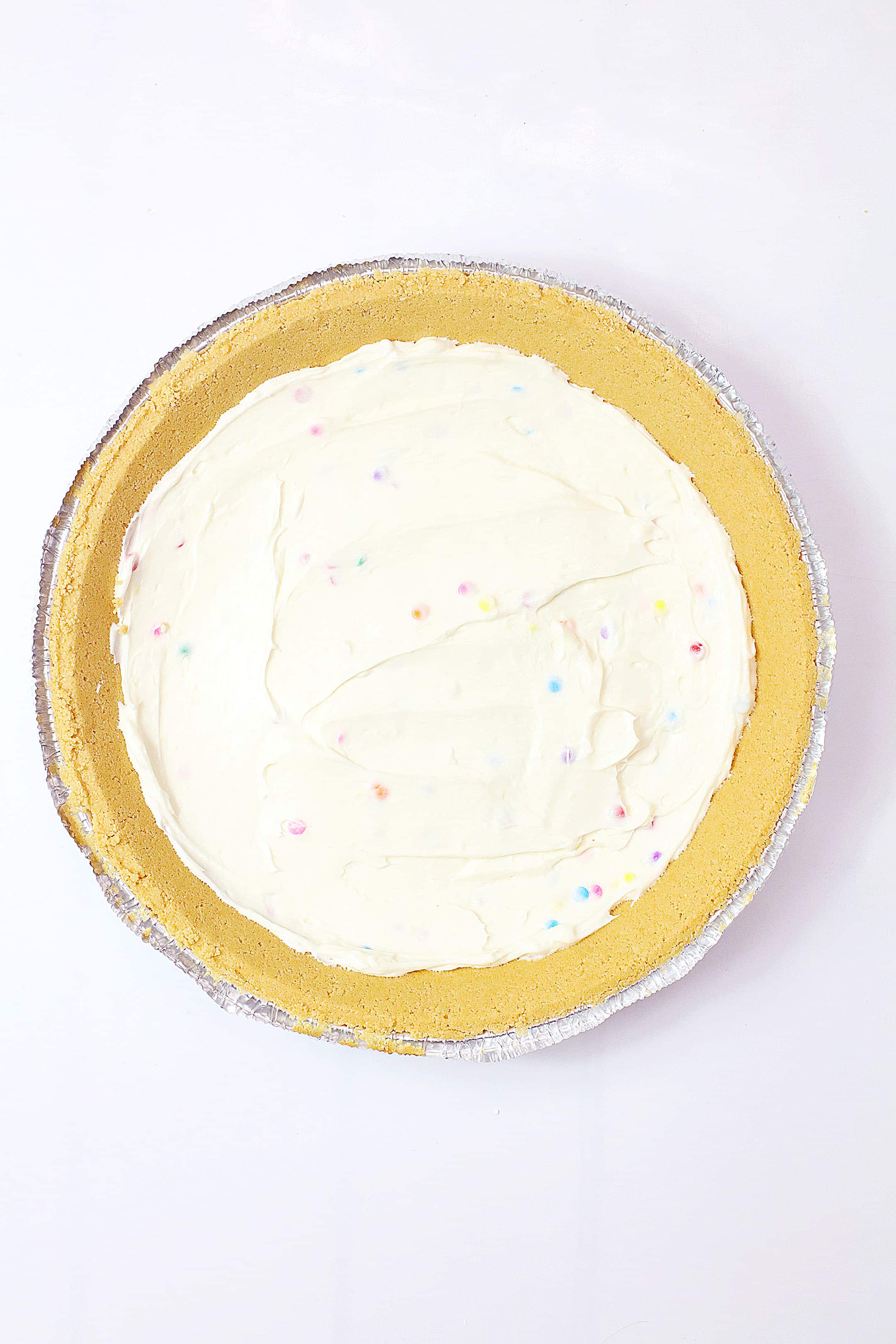 cake batter pie filling in a graham cracker crust