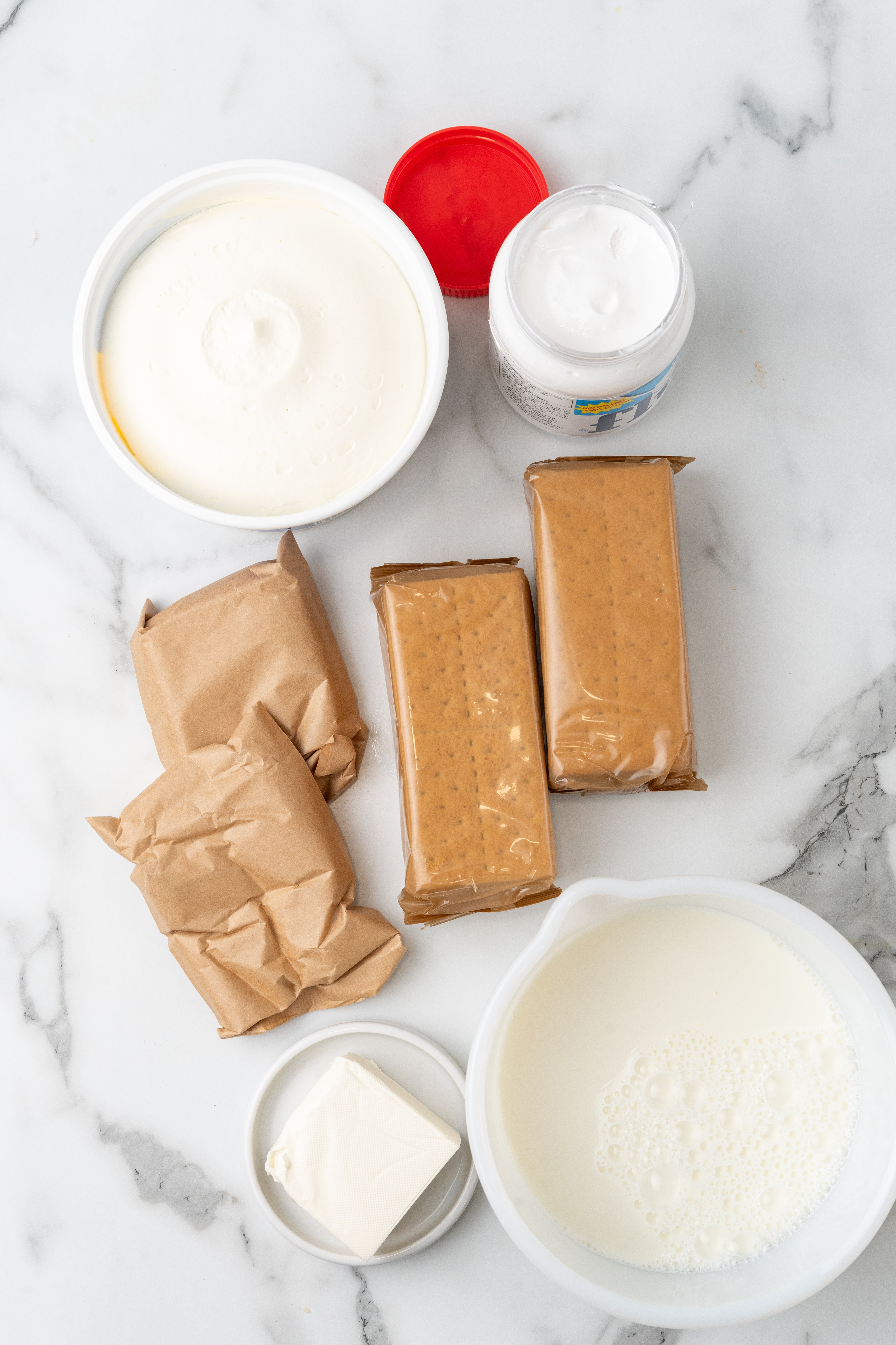 an overhead image showing the measured ingredients needed to make a batch of frozen s'mores