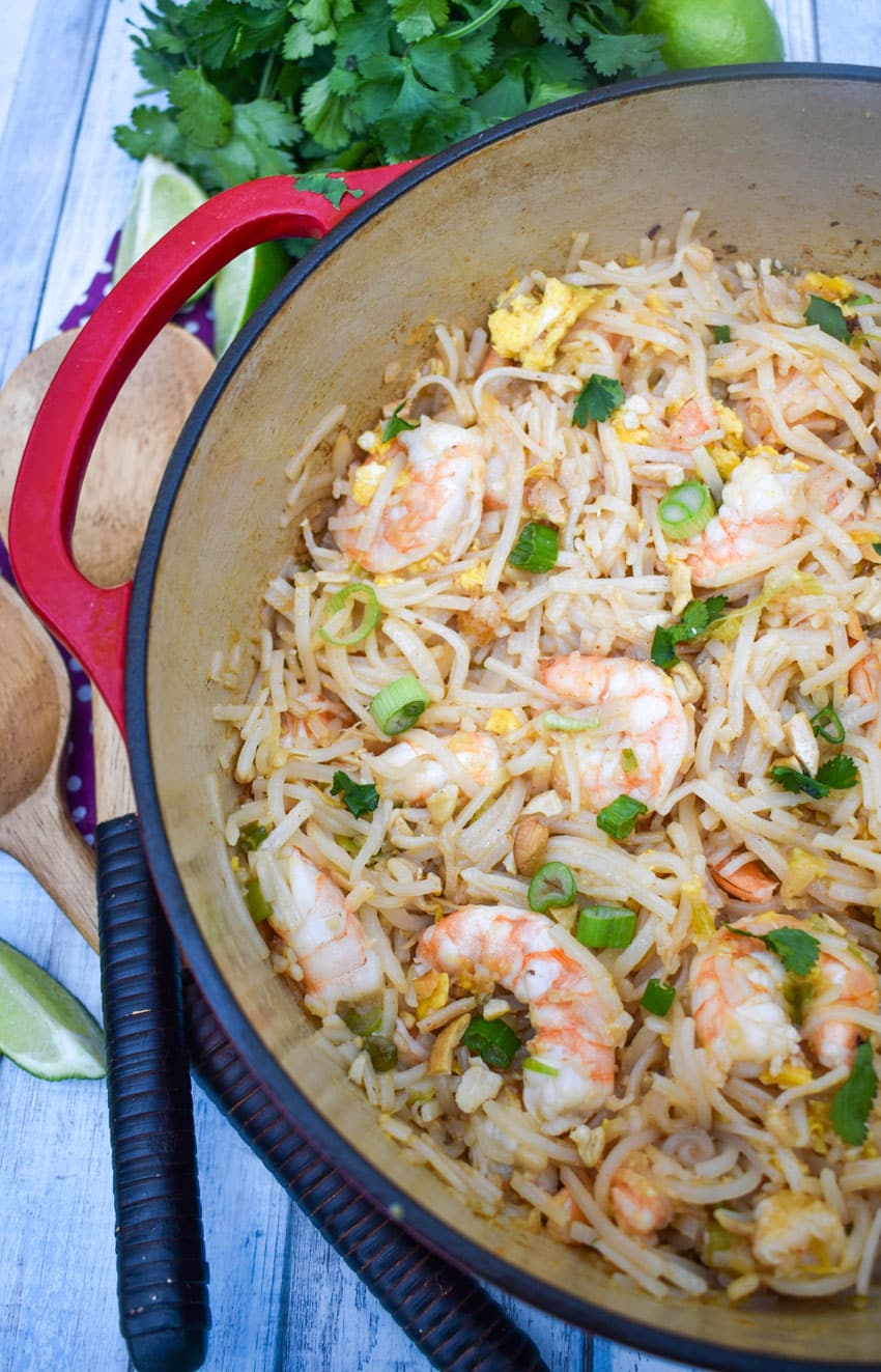 shrimp pad thai noodles in a red dutch oven