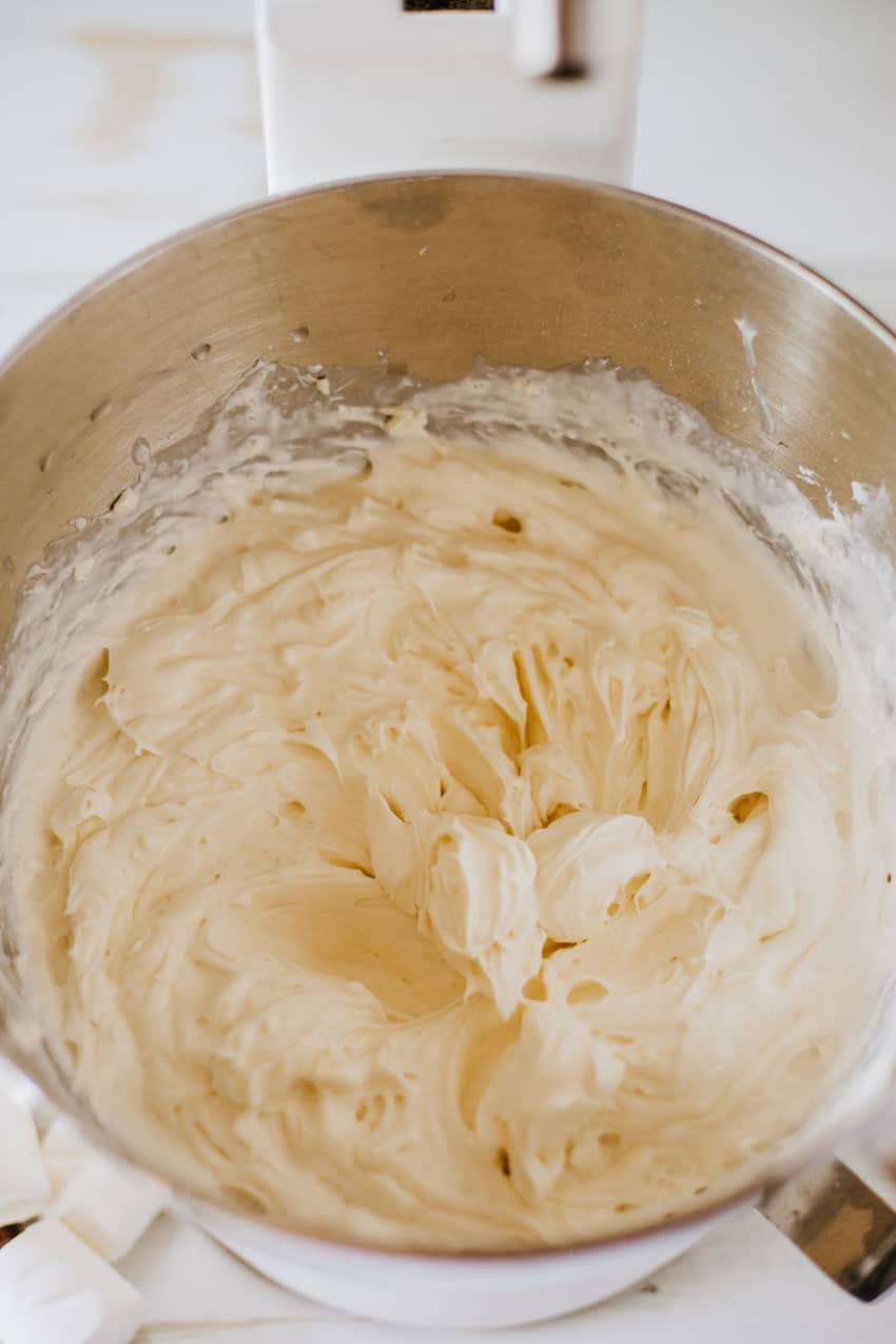 whipped marshmallow cream cheese in a metal mixing bowl