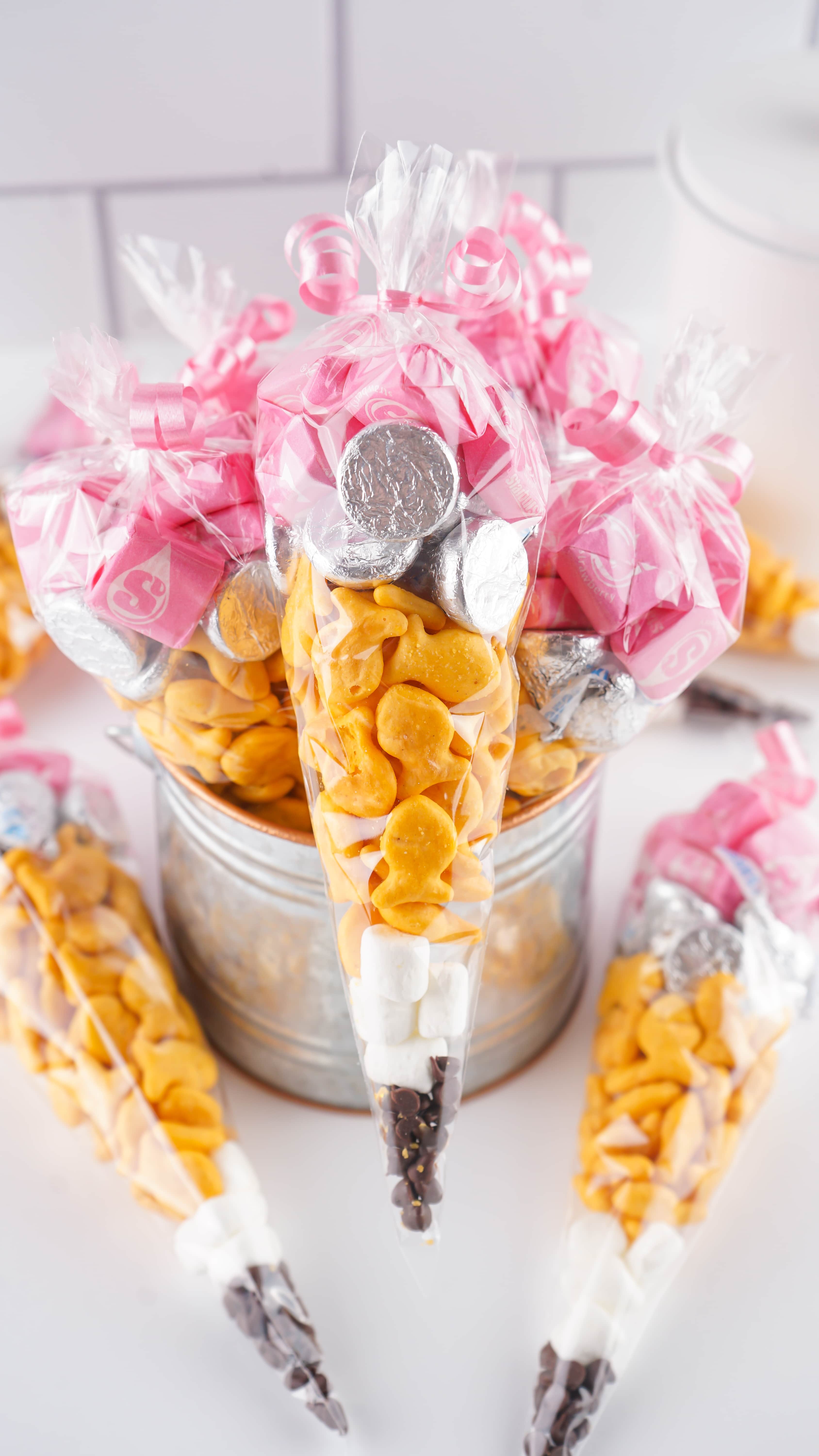 A PILE OF BACK TO SCHOOL TREAT BAGS ON A WHITE COUNTERTOP 