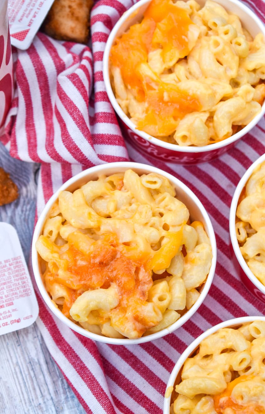 chick fil a mac and cheese copycat recipe in four small red paper bowls